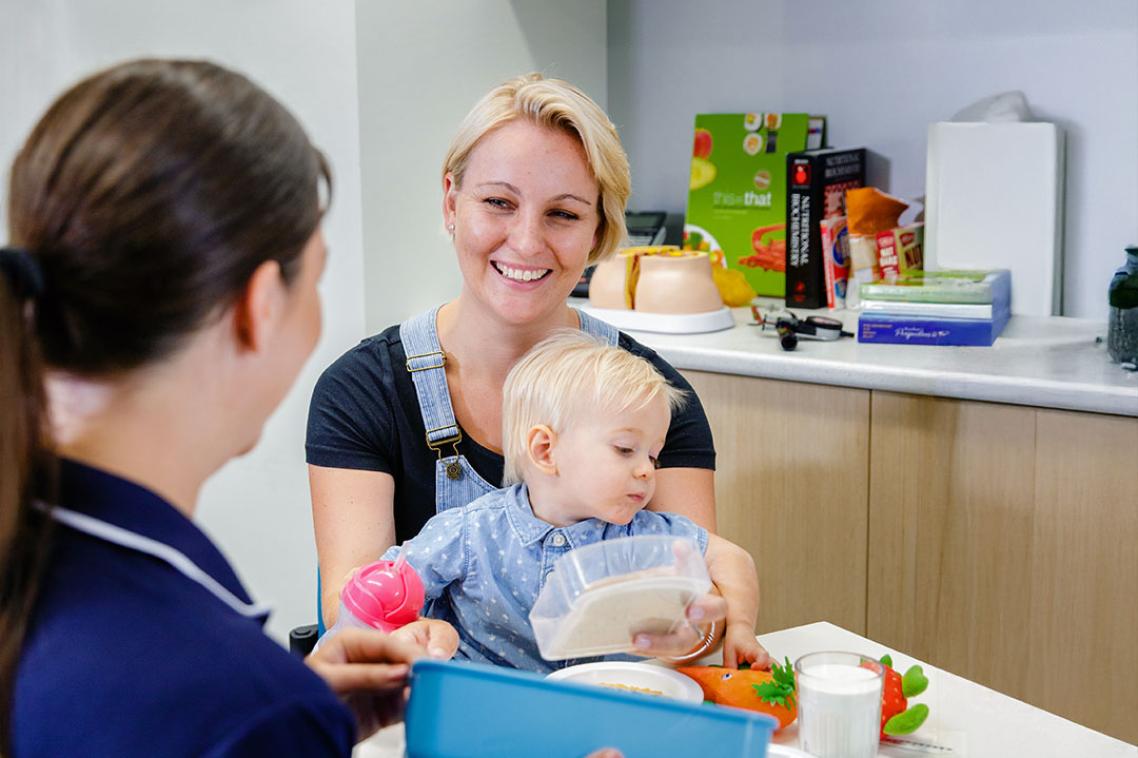 Mum and baby learning about nutrition